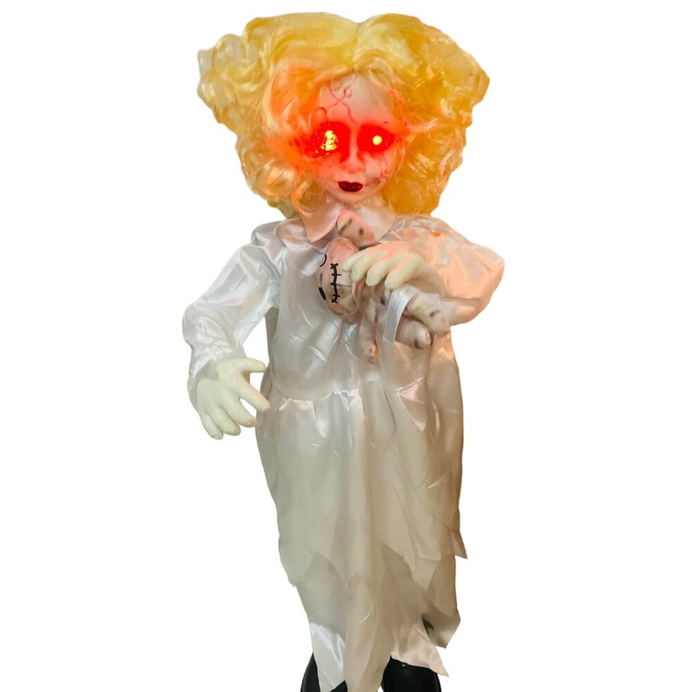 Halloween Scary doll makes laughing noises and moves arms